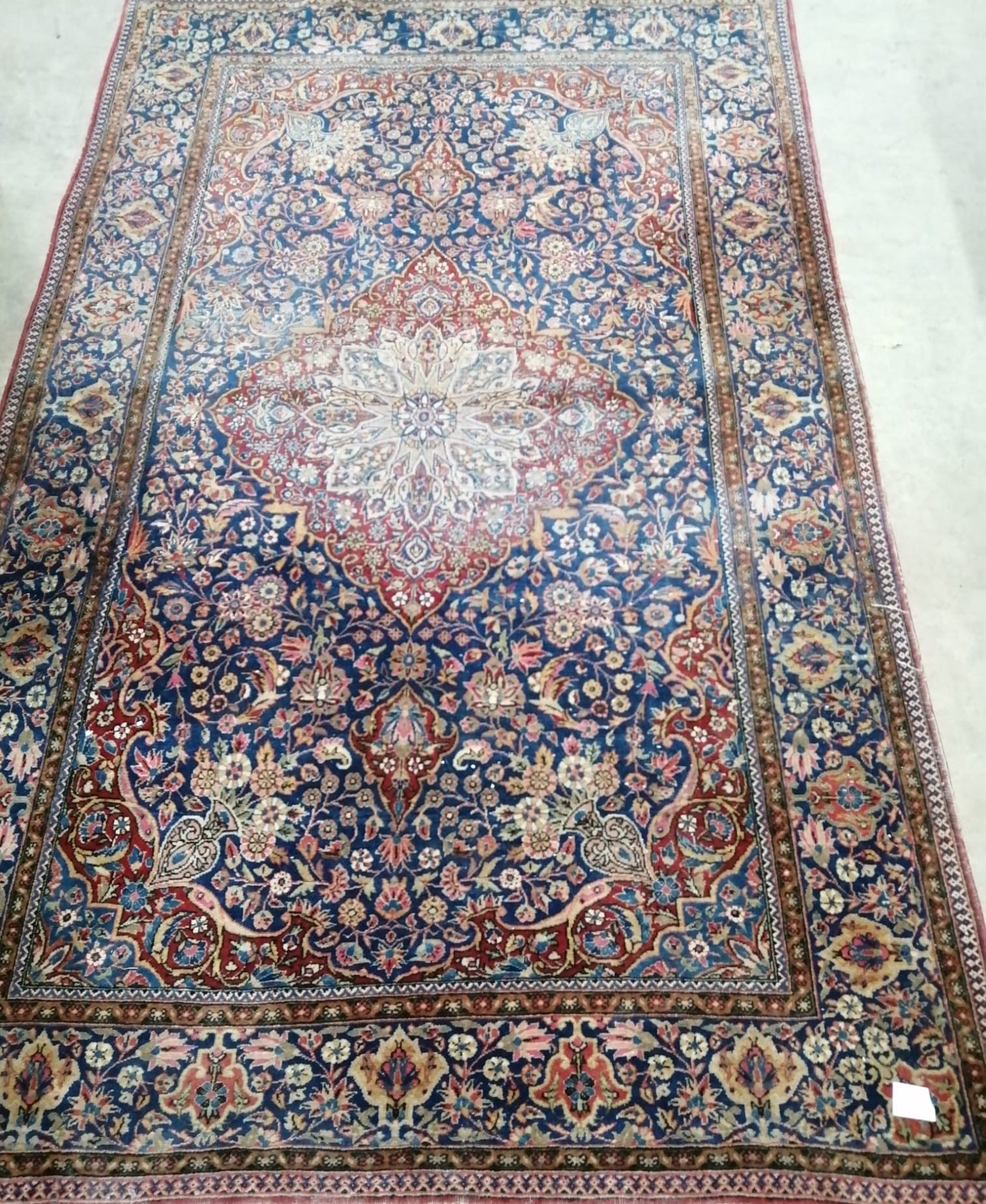 A pair of early 20th century Kashan blue ground rugs, 200 x 128cm (worn)